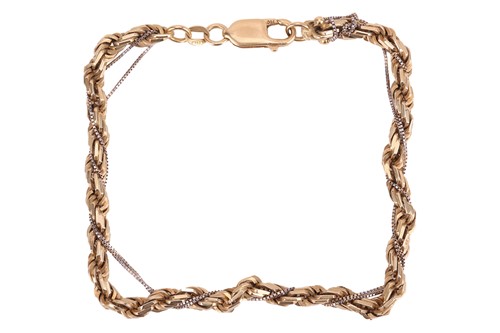 Lot 117 - A two-toned twisted rope bracelet, accented...