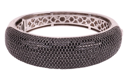Lot 16 - Ti Sento - a hinged gem-set bangle, the domed...
