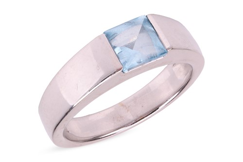 Lot 103 - A topaz dress ring, comprising a square sky...