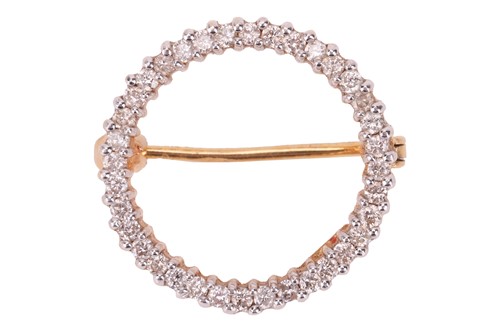 Lot 66 - A diamond-set open circle brooch, claw-set...