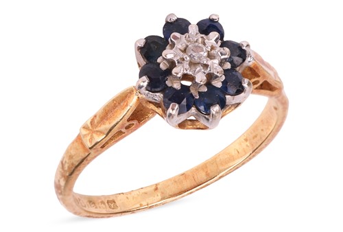 Lot 53 - A sapphire and diamond cluster ring in 18ct...