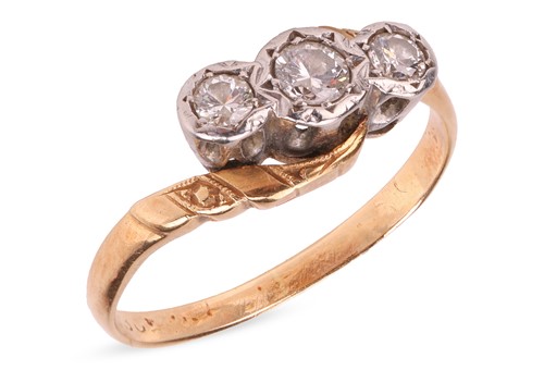Lot 68 - A diamond-set three-stone ring, of crossover...