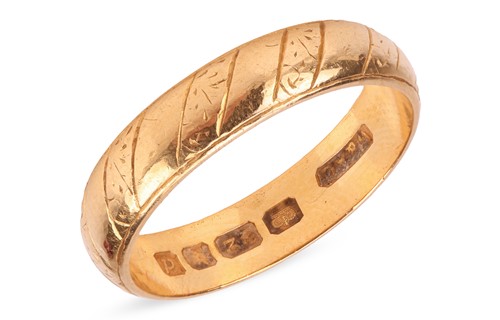 Lot 51 - A wedding band in 22ct yellow gold, the...