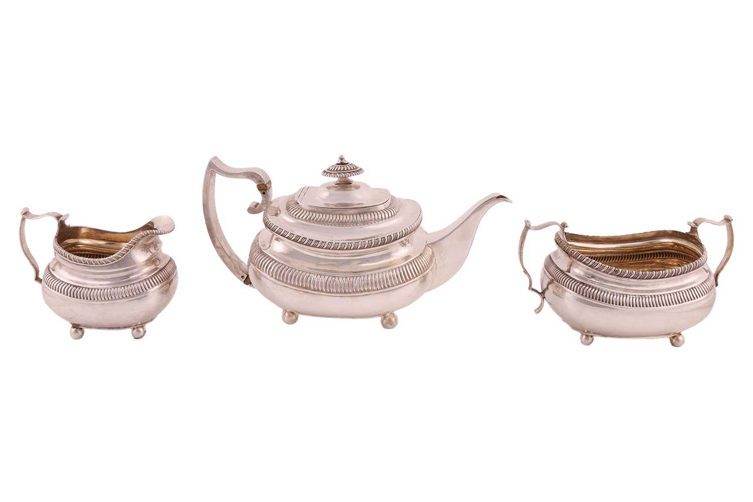 Lot 351 - A George III silver three-piece tea service,...