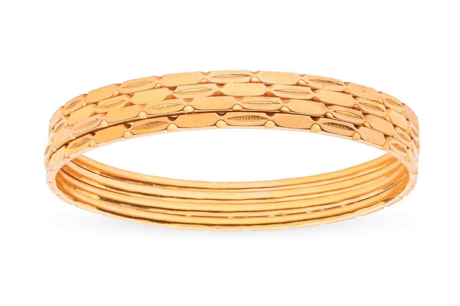 Lot 147 - A set of four Indian bangles; each bangle of...