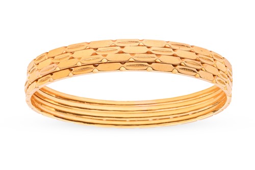Lot 147 - A set of four Indian bangles; each bangle of...