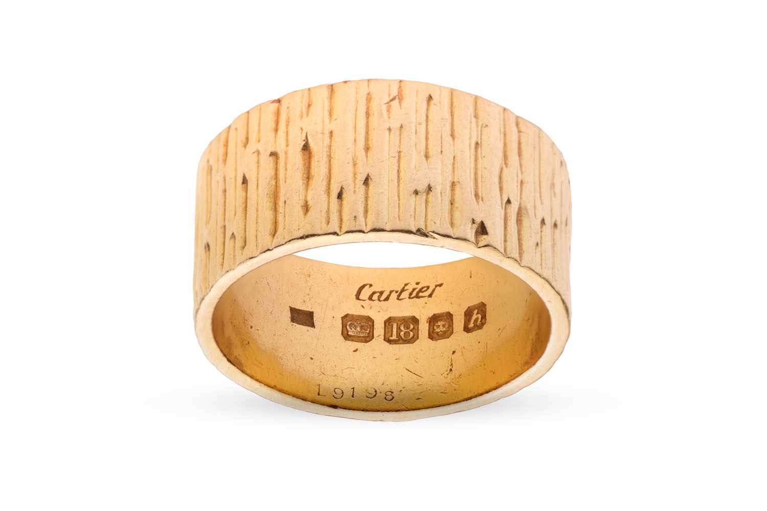 Lot 80 - Cartier - a textured ring band in 18ct yellow...