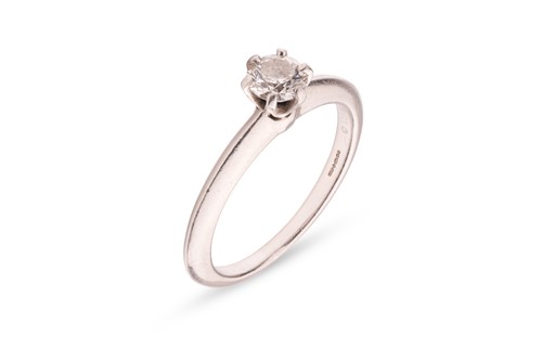 Lot 241 - Tiffany & Co. - A diamond single-stone ring,...