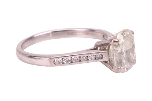 Lot 186 - A diamond solitaire ring in 18ct white gold,...