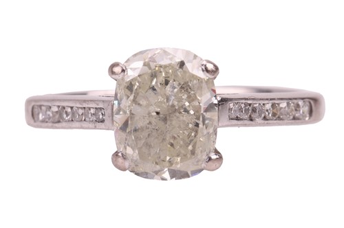Lot 186 - A diamond solitaire ring in 18ct white gold,...