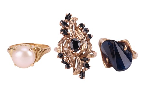 Lot 13 - Three gem-set dress rings, comprising a...