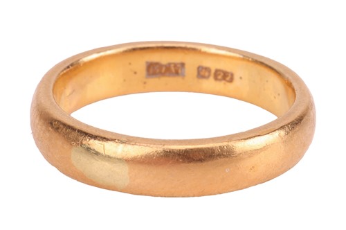 Lot 101 - A 22ct gold band ring, measuring 3.5mm in...