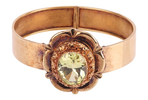 Lot 22 - A Victorian floral hinged bangle set with...