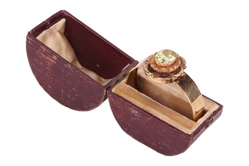 Lot 22 - A Victorian floral hinged bangle set with...