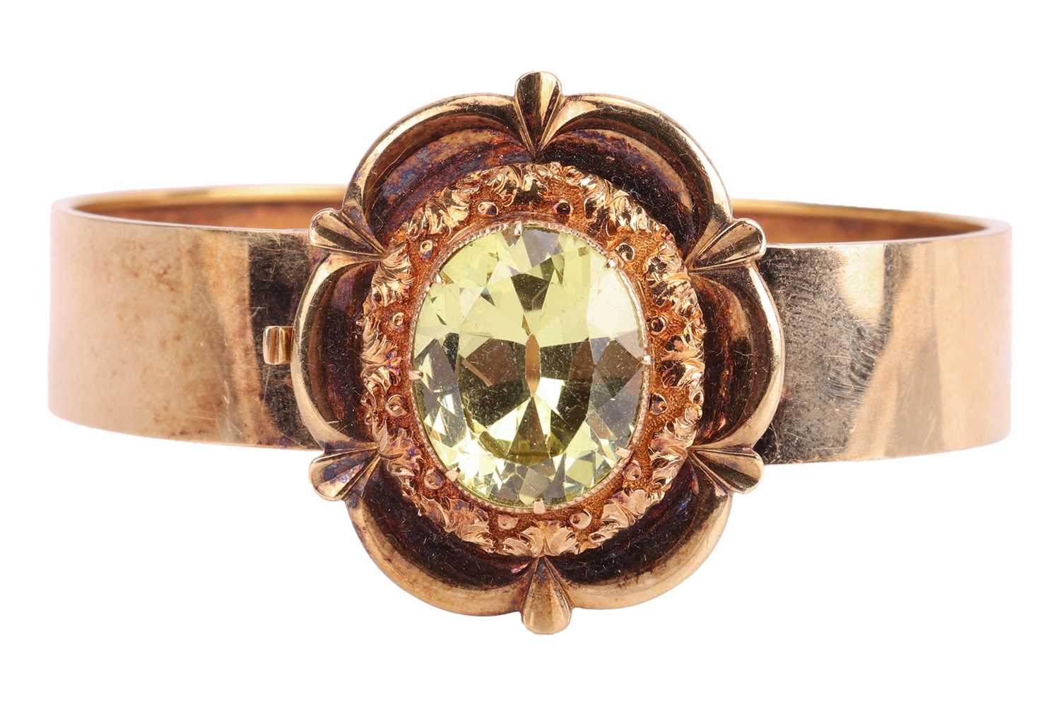 Lot 22 - A Victorian floral hinged bangle set with...