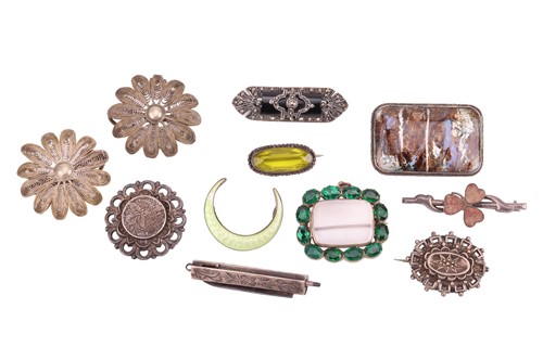Lot 176 - A small collection of white metal brooches; to...