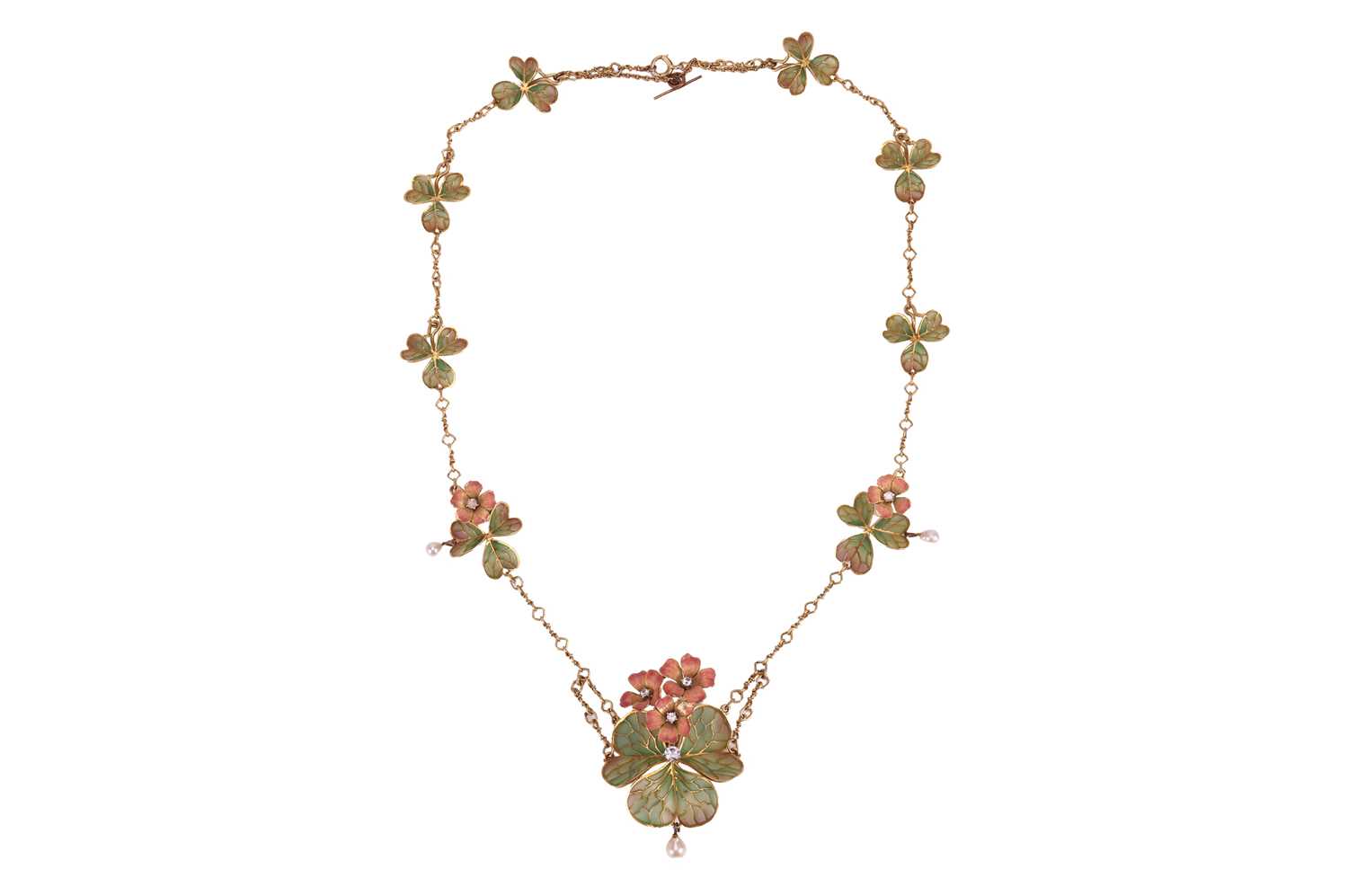 Lot 69 - An Art Nouveau shamrock plique-à-jour enamel...