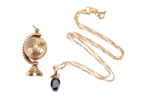 Lot 154 - A sapphire and diamond pendant in yellow metal...