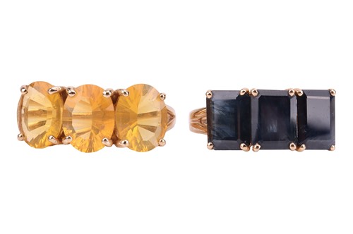 Lot 165 - A pair of gem-set rings, the first claw-set...