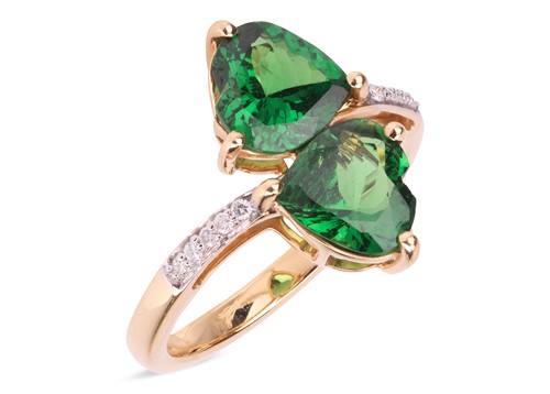Lot 88 - A tsavorite garnet crossover ring in 18ct gold,...