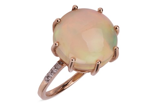 Lot 167 - An opal and diamond ring, the eight-claw set...