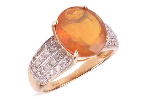 Lot 146 - A fire opal dress ring, the oval-shaped fire...