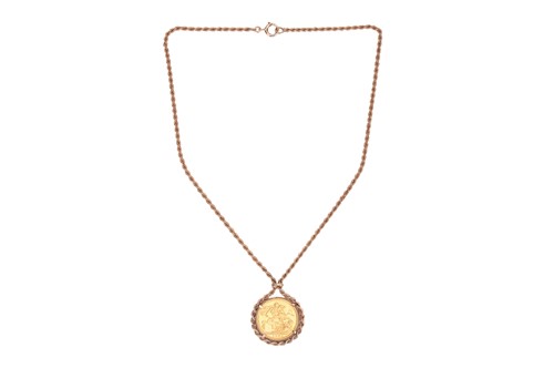 Lot 105 - A sovereign pendant necklace, set with a...