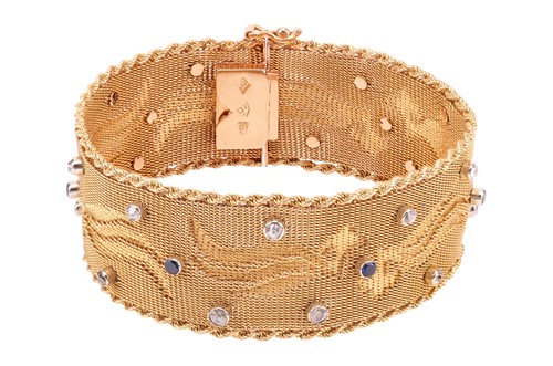 Lot 68 - A woven mesh bracelet with sapphire and...
