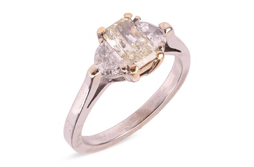 Lot 297 - A three-stone diamond ring centred with a...