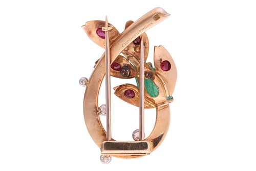 Lot 79 - Cartier - a spray clip brooch set with emerald,...