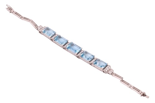 Lot 73 - An aquamarine and diamond link bracelet,...