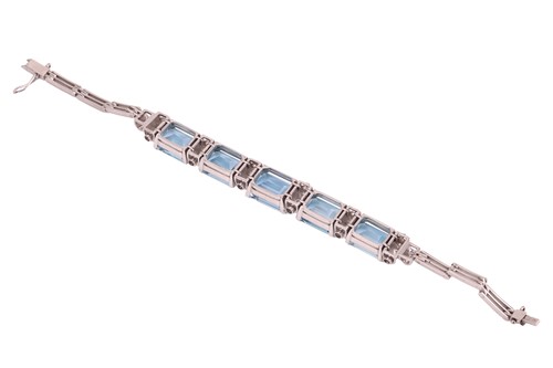 Lot 73 - An aquamarine and diamond link bracelet,...