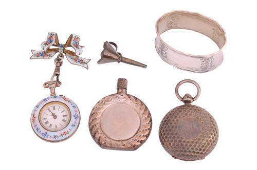 Lot 135 - An enamel fob watch on bow brooch, with...