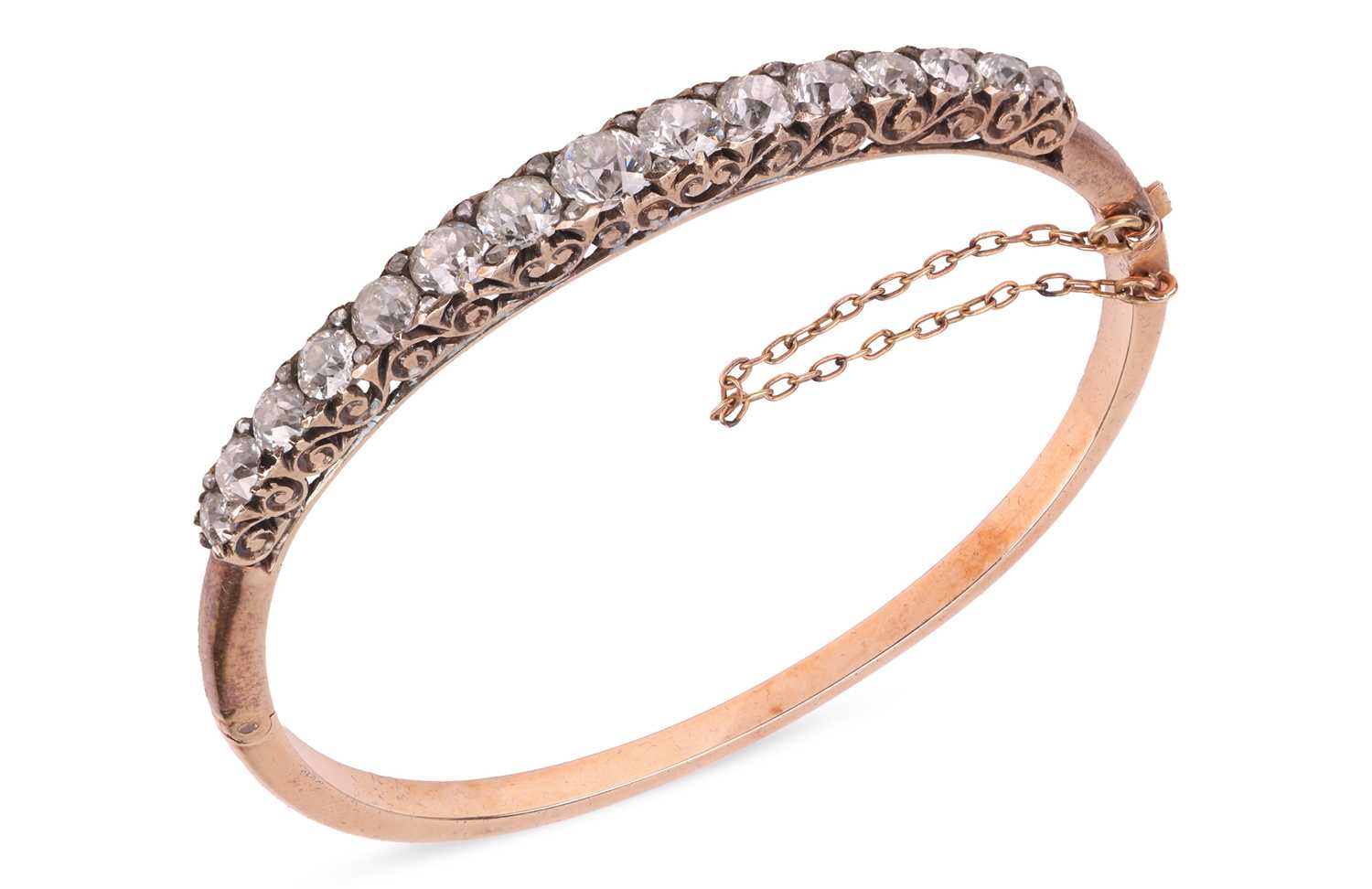 Lot 67 - A late Victorian half hoop diamond bangle, the...