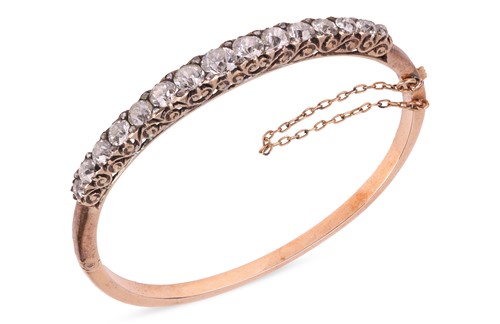 Lot 67 - A late Victorian half hoop diamond bangle, the...
