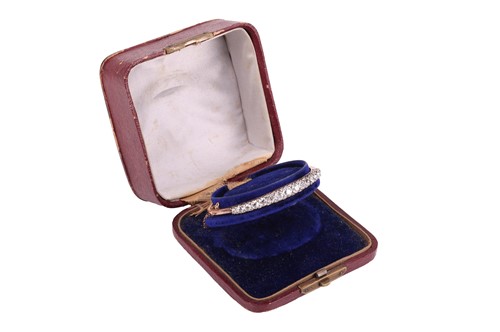 Lot 67 - A late Victorian half hoop diamond bangle, the...