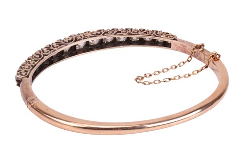 Lot 67 - A late Victorian half hoop diamond bangle, the...