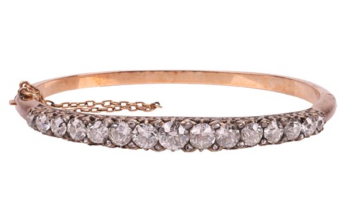 Lot 67 - A late Victorian half hoop diamond bangle, the...