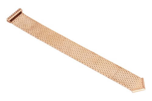 Lot 103 - A jarretière slide bracelet, comprising a...