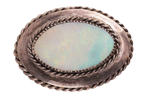 Lot 62 - An Arts and Crafts opal brooch, featuring an...
