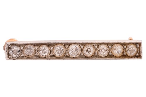 Lot 58 - A diamond-set bar brooch, set with nine...