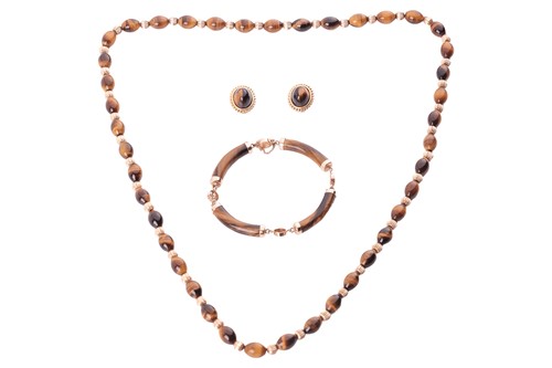Lot 122 - A collection of jewellery set with tiger’s eye;...