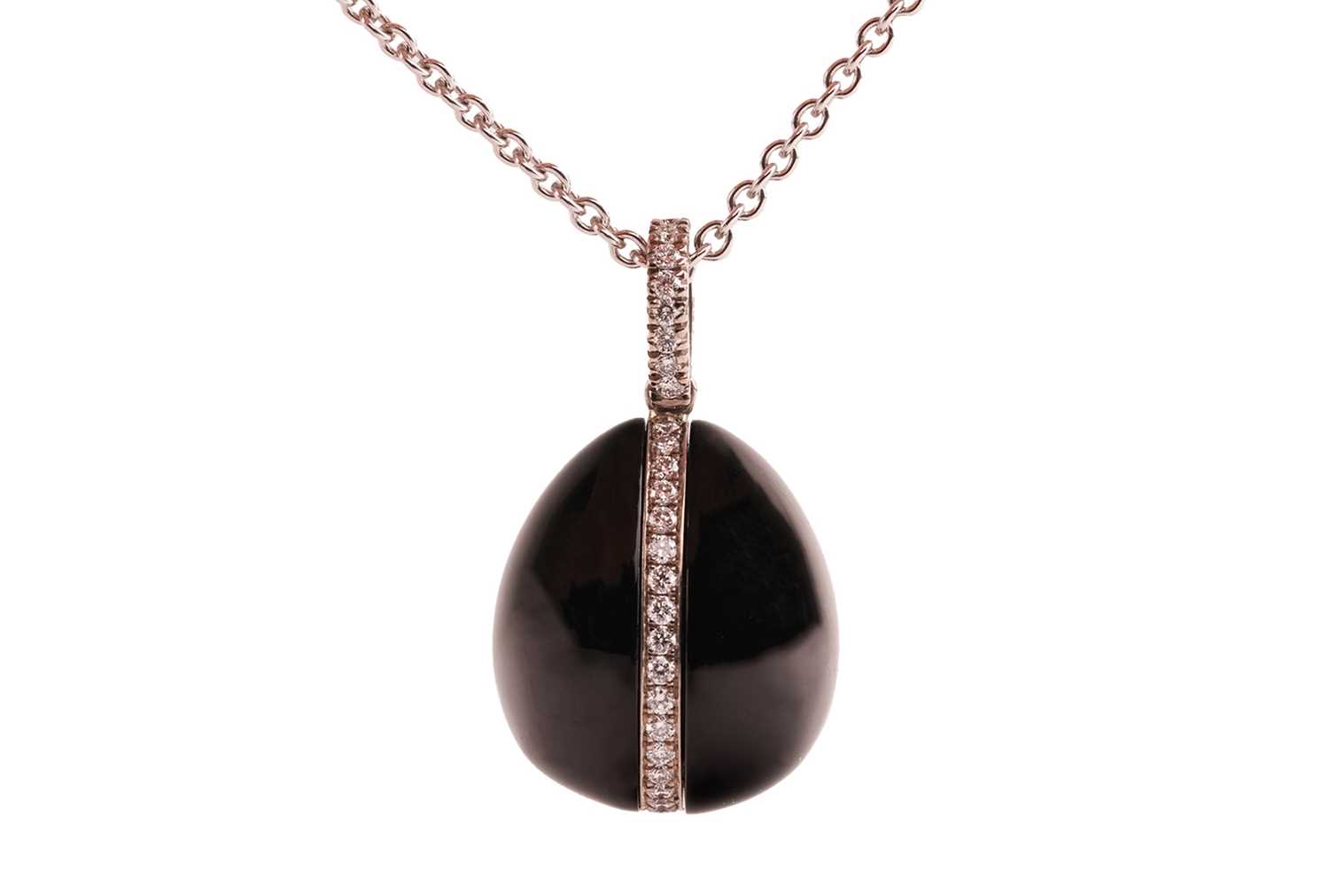 Lot 225 - Fabergé - A Whitby jet and diamond egg pendant...