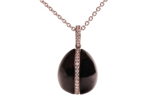Lot 225 - Fabergé - A Whitby jet and diamond egg pendant...