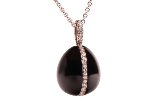 Lot 225 - Fabergé - A Whitby jet and diamond egg pendant...