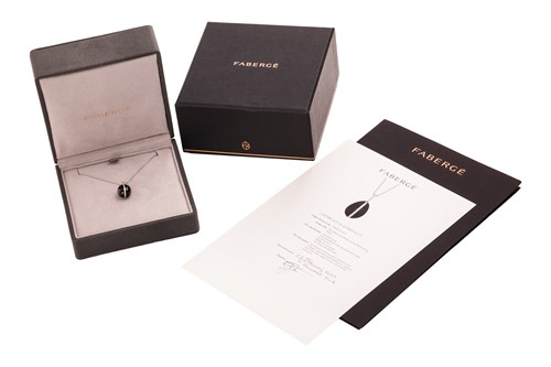 Lot 225 - Fabergé - A Whitby jet and diamond egg pendant...