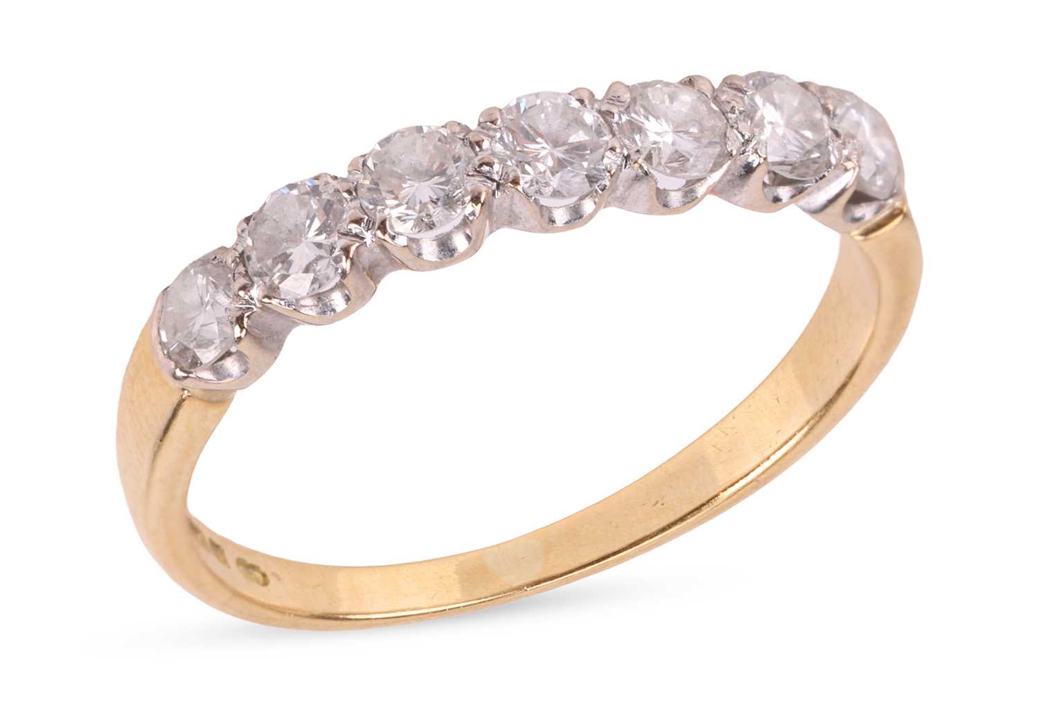 Lot 150 - A diamond half eternity ring, featuring seven...