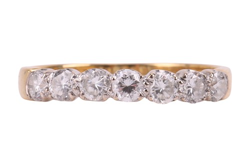Lot 150 - A diamond half eternity ring, featuring seven...