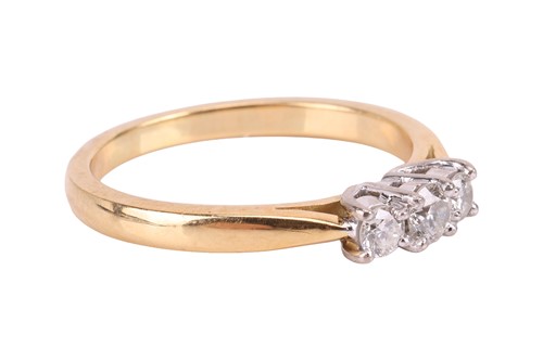 Lot A diamond three stone ring, comprising three...