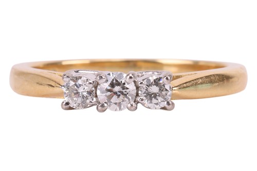 Lot A diamond three stone ring, comprising three...
